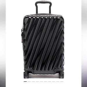TUMI International Expandable 4 Wheeled Carry-On USED one trip with min wear